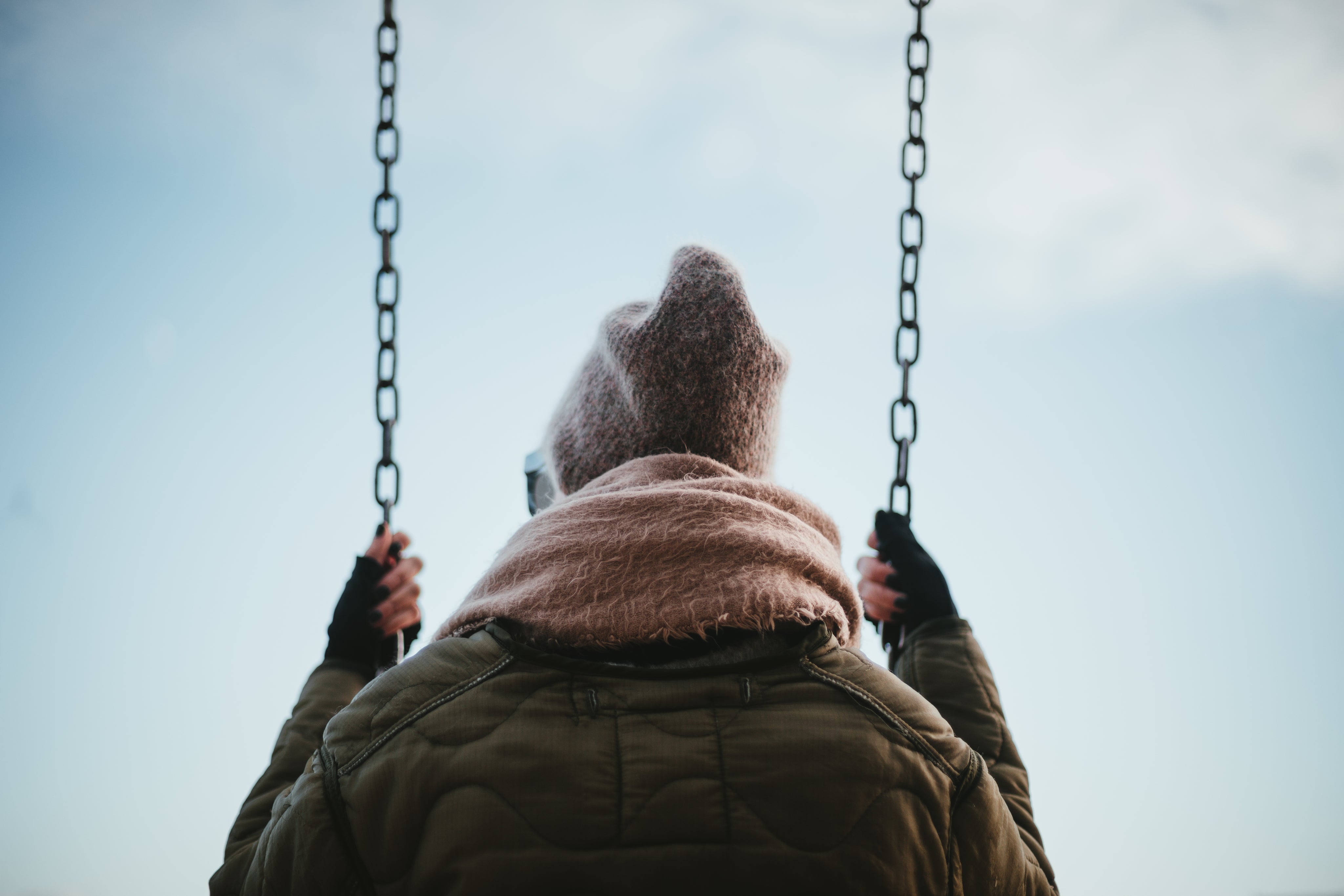 files/low-view-of-young-woman-sat-on-swing.jpg